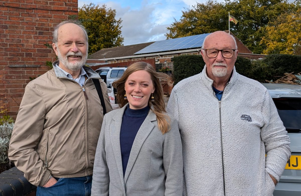 Mike Kinghan with Sarah Edwards and Whittington Village Hall chair Garry Hyde
