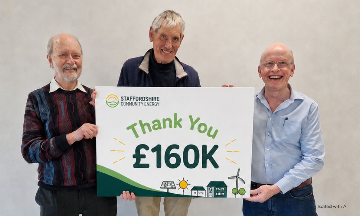 SCE Blog Media (1) Three smiling Staffordshire Community Energy Board members hold a sign reading “Thank You £160K”, celebrating the successful Lichfield Leisure Centre Community Share Offer.